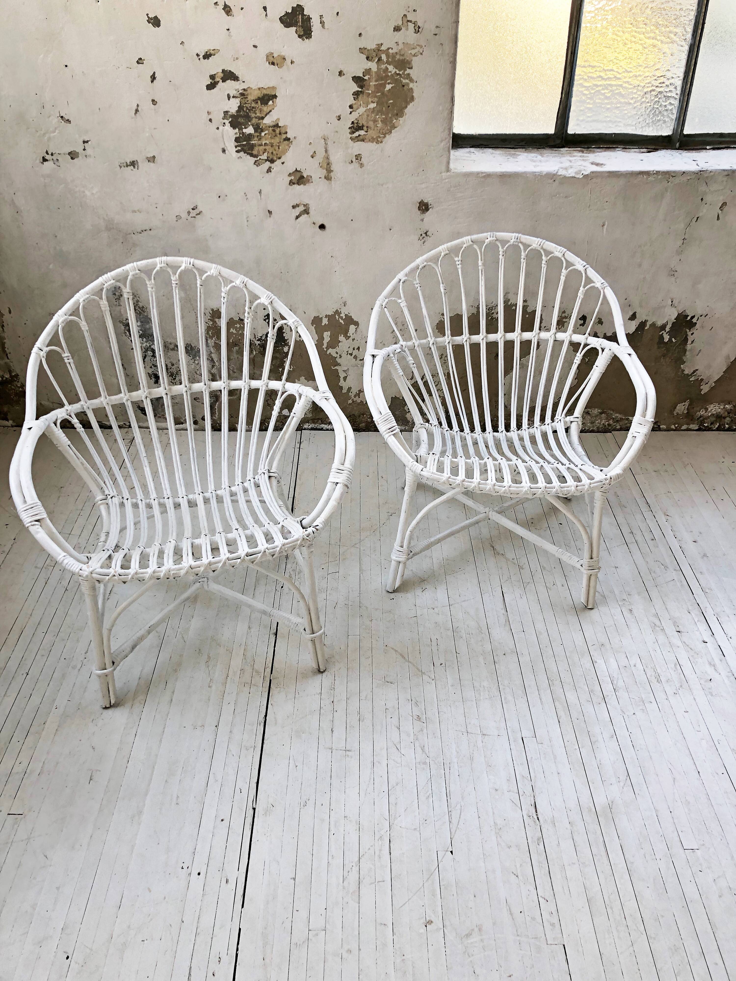 Pair of white rotin armchairs
