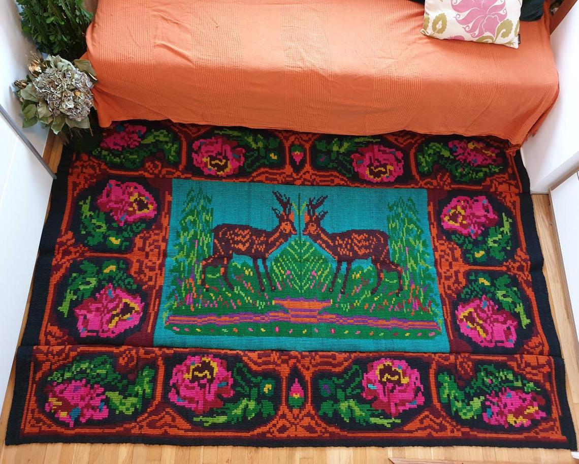 Vintage Romanian rug with deers, nature scenery on a floral background