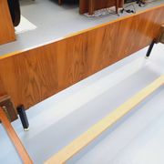 Double bed vintage modernist in teak and black metal from the 1960s with bedside tables.
