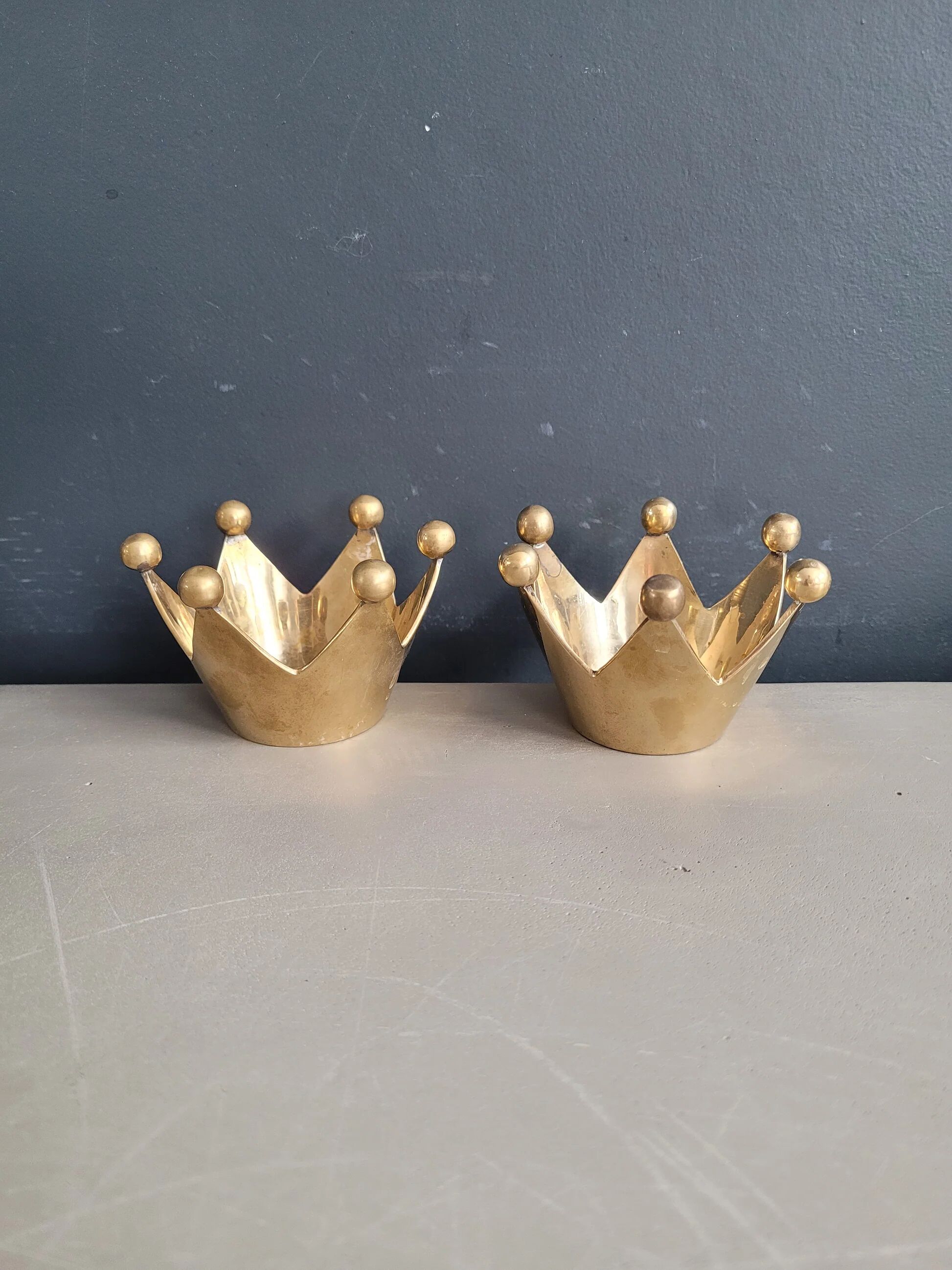 Pair of crown candle holders in brass