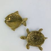 Pair of animal trinket trays in brass, fish and turtle.