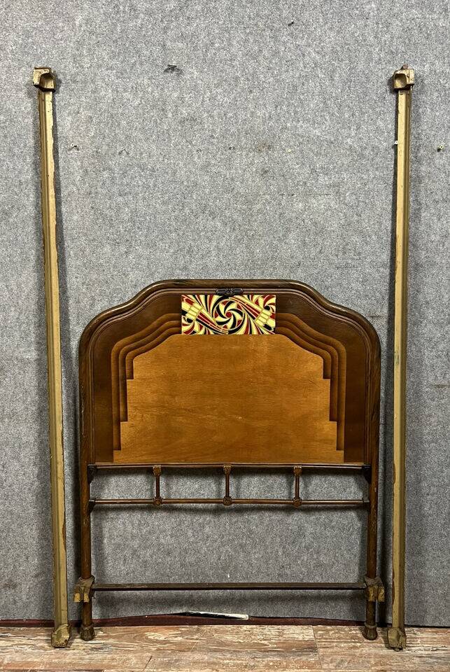 Art Nouveau period bed in painted iron faux wood with stylized colored patterns