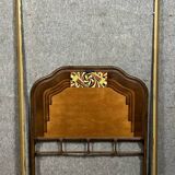 Art Nouveau period bed in painted iron faux wood with stylized colored patterns