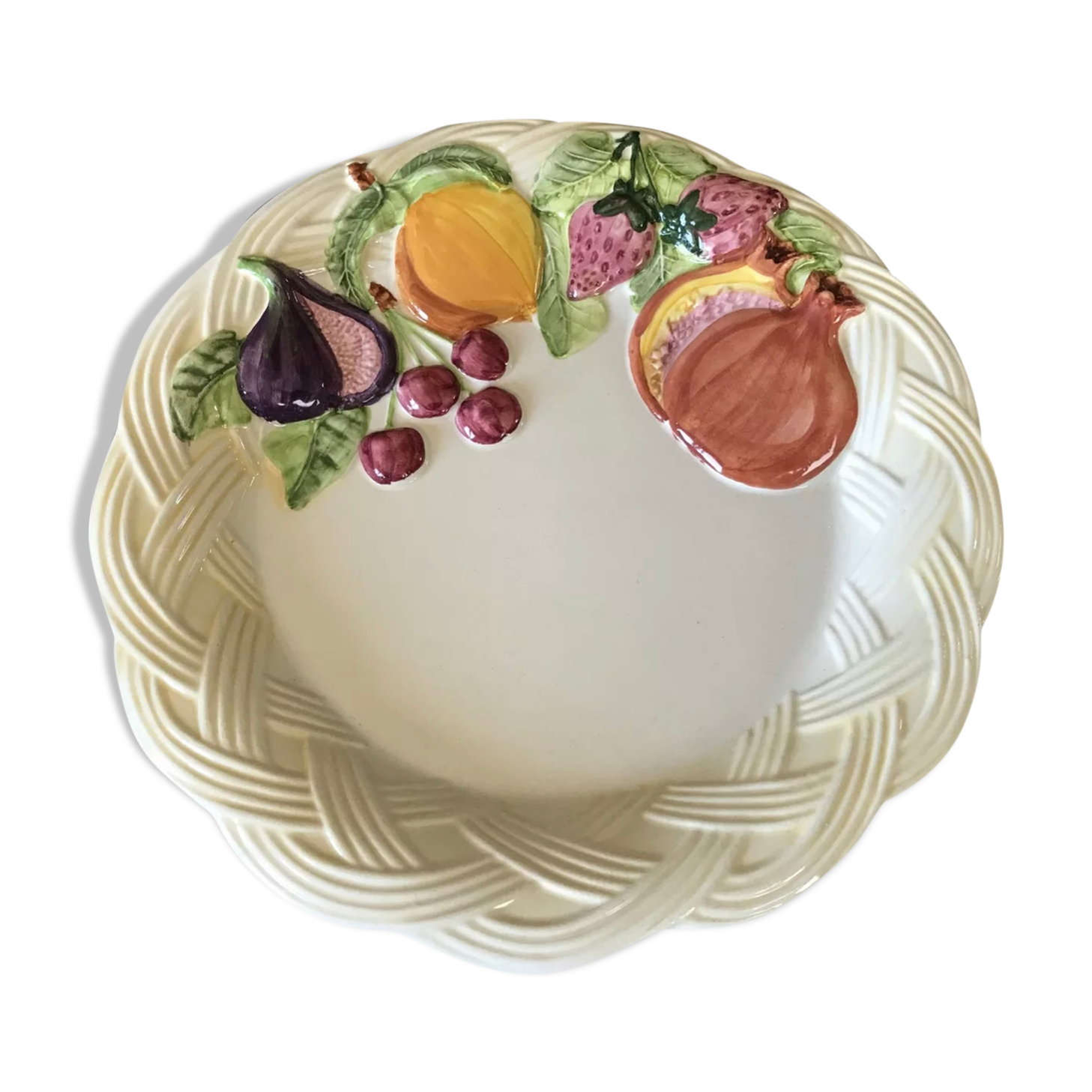 Vintage plate in ceramic enamelled decoration of fruits in relief