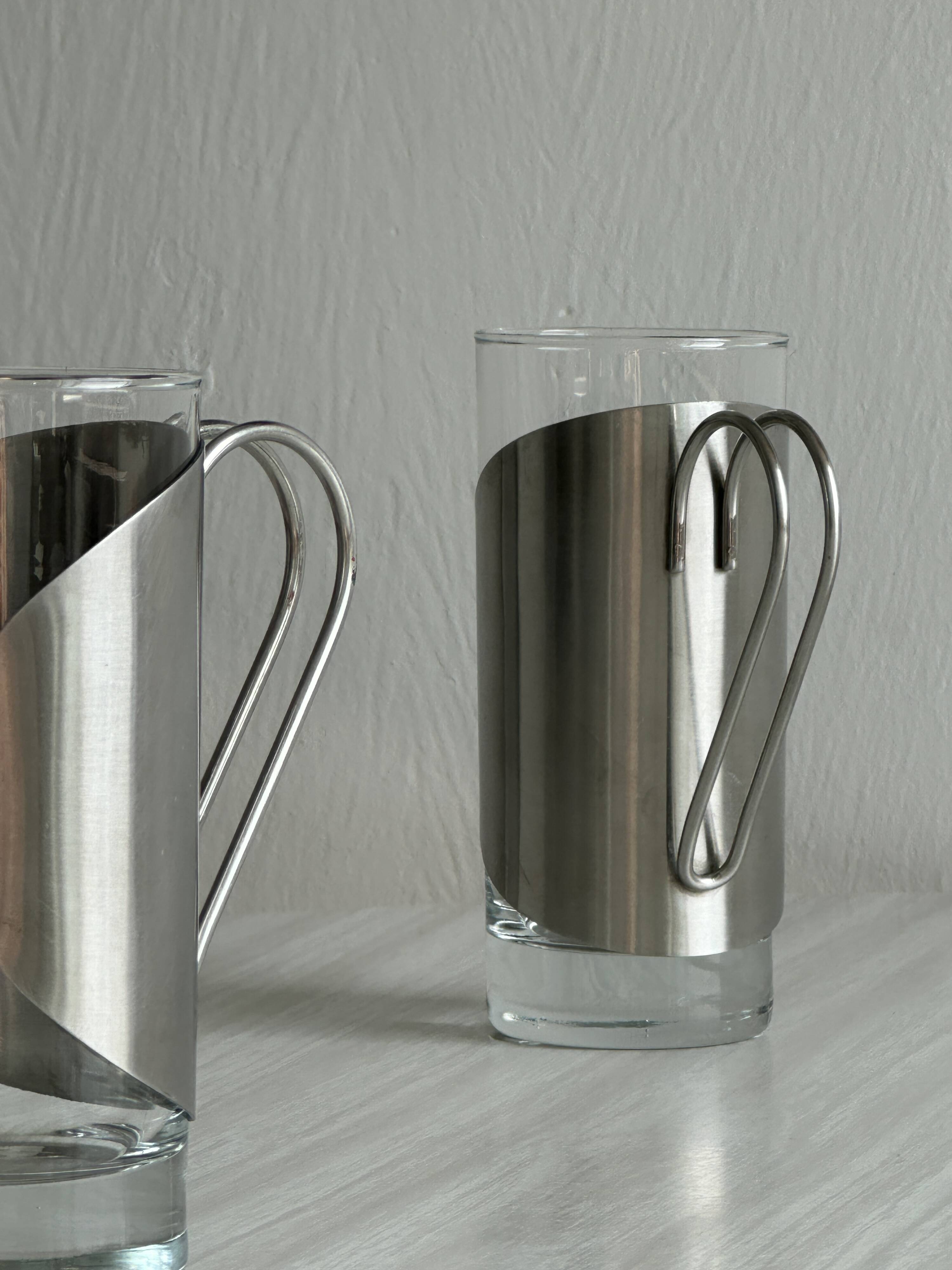 2 glasses with metal handles, stainless steel.