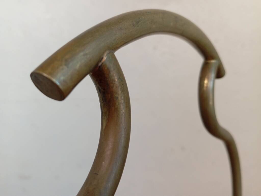 Brass magazine rack in neo-classical style, 20th century.
