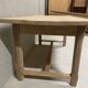 Large solid wood table with a sleek design – integrated storage.