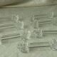 Set of 7 glass knife rests featuring a small duck.