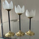 Trio of glass and metal candle holders