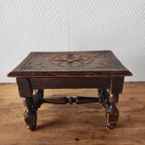 Old carved wooden footrest