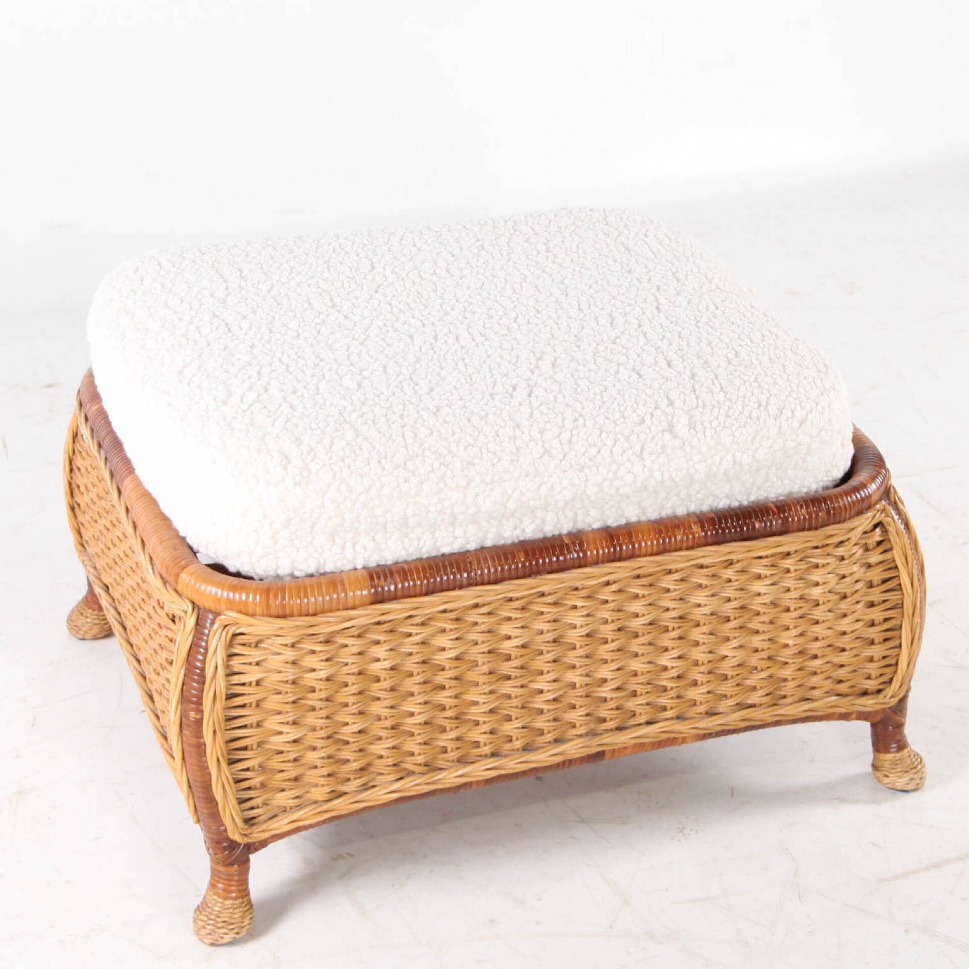 Large wicker armchair and its ottoman