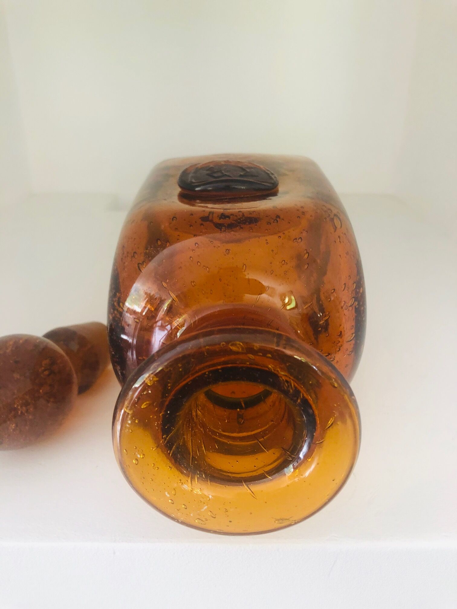 Old carafe in amber and bulled Biot glass, stamp 1496.