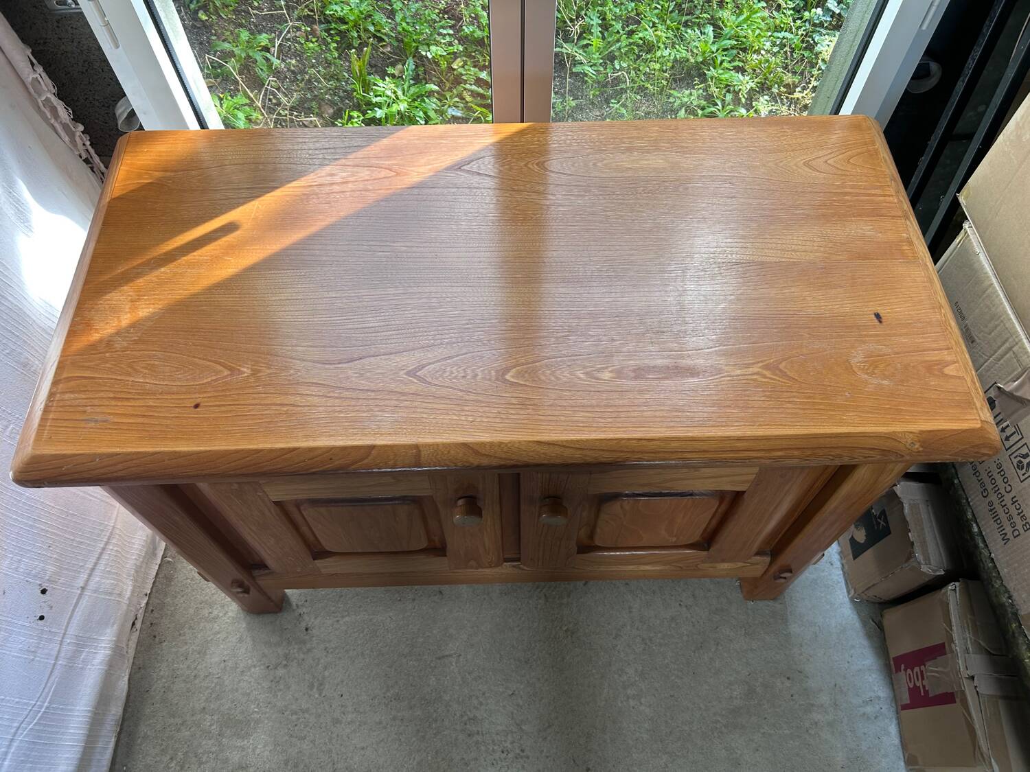 Small varnished wooden buffet