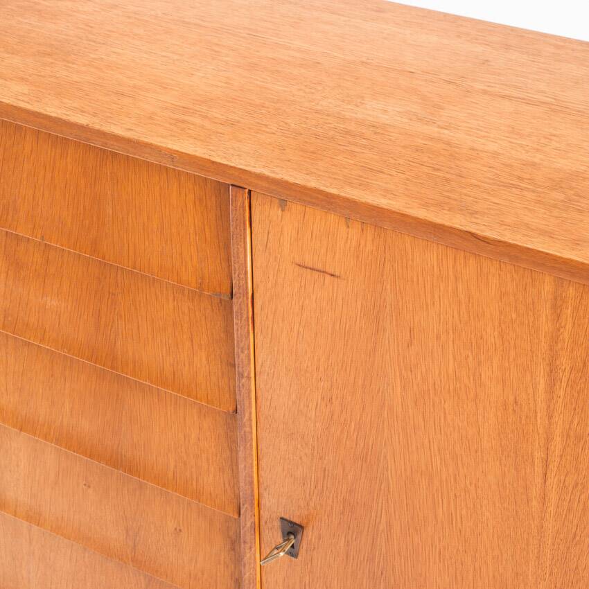 Vintage sideboard. Oak wood, drawers and door. France, 1960s