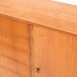Vintage sideboard. Oak wood, drawers and door. France, 1960s