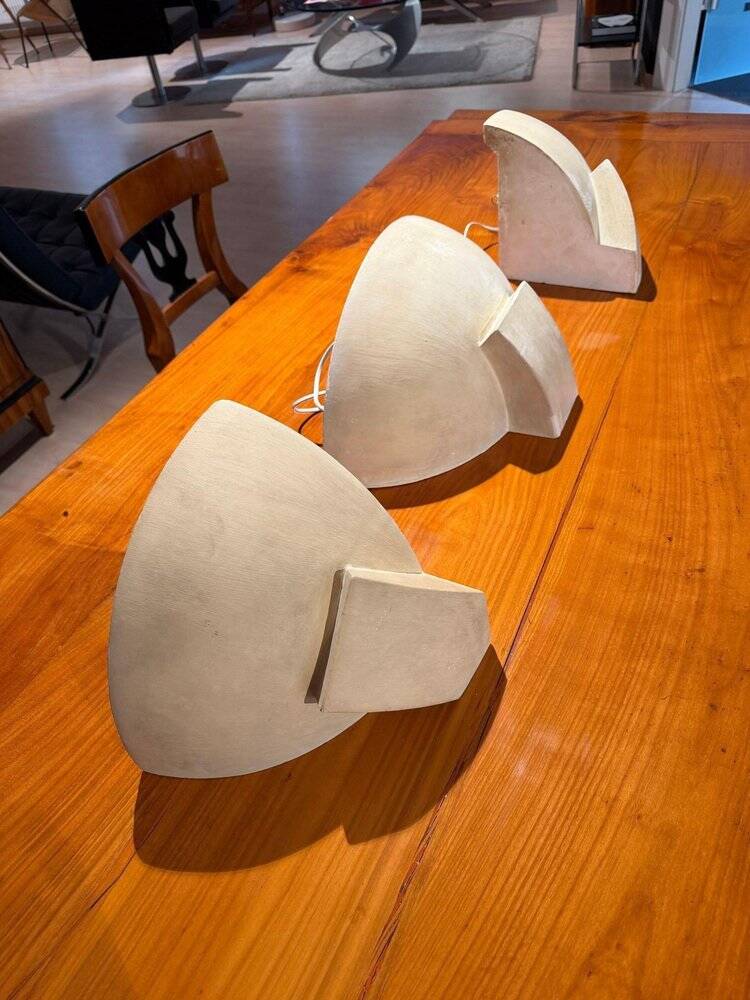 Art Deco wall lights in patinated plaster, France, 1925, set of 3