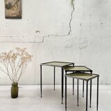 Suite of metal and glass nesting tables.