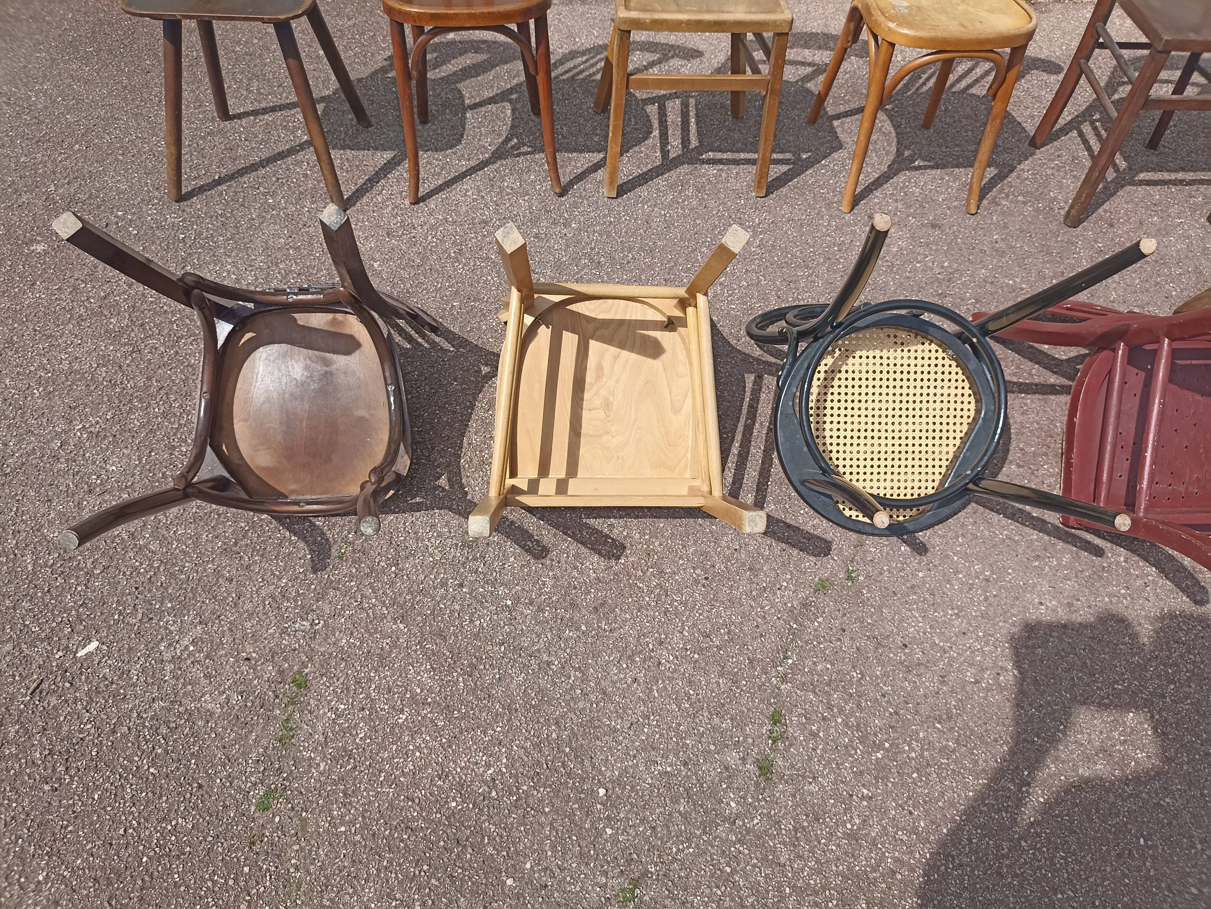 Set of 12 mismatched wooden bistro chairs