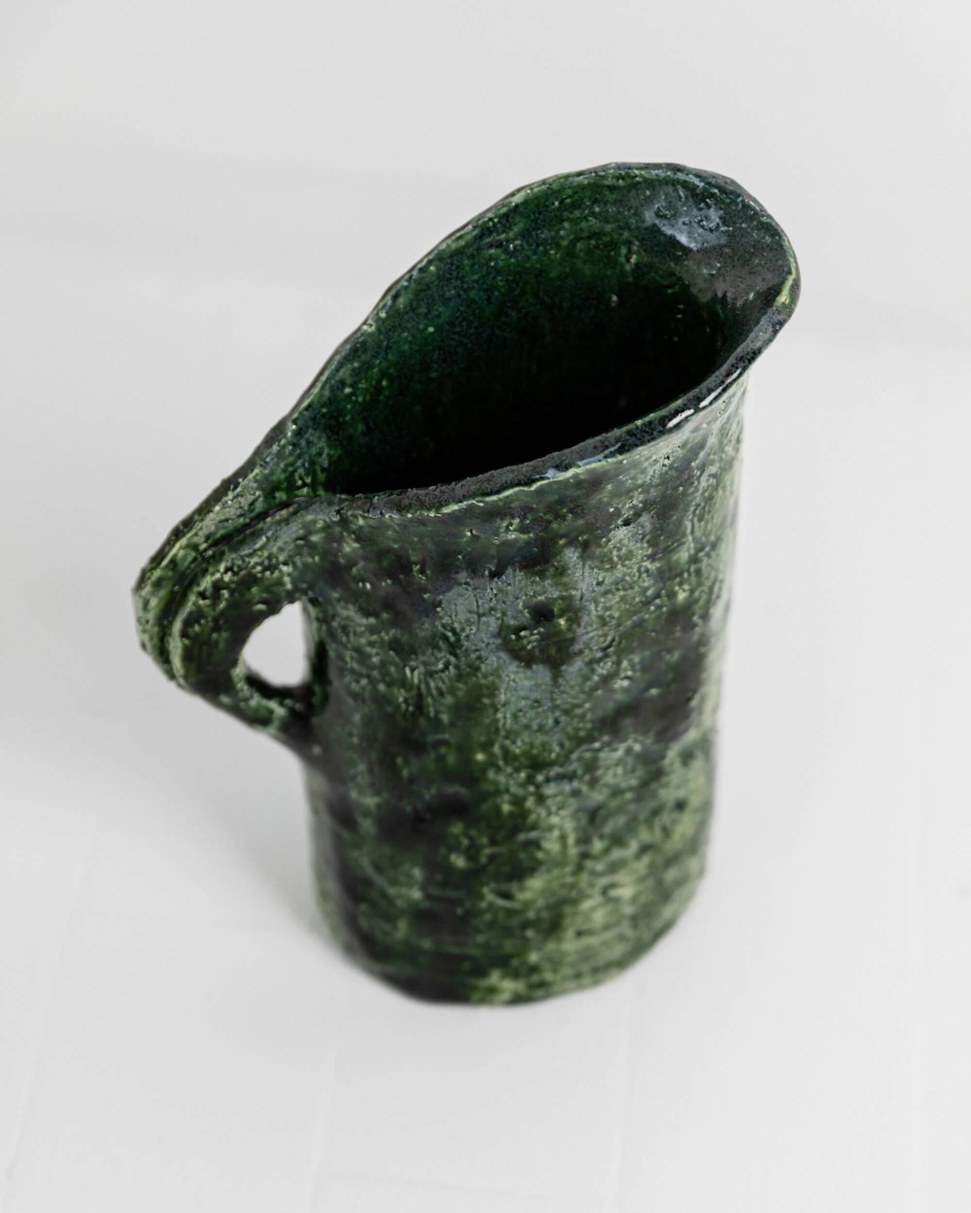 Vintage 1970s studio ceramic vase or pitcher, glazed green.