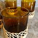 Pitcher and amber glasses and rattan