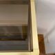 Regency style console table, in gilded metal and smoked glass