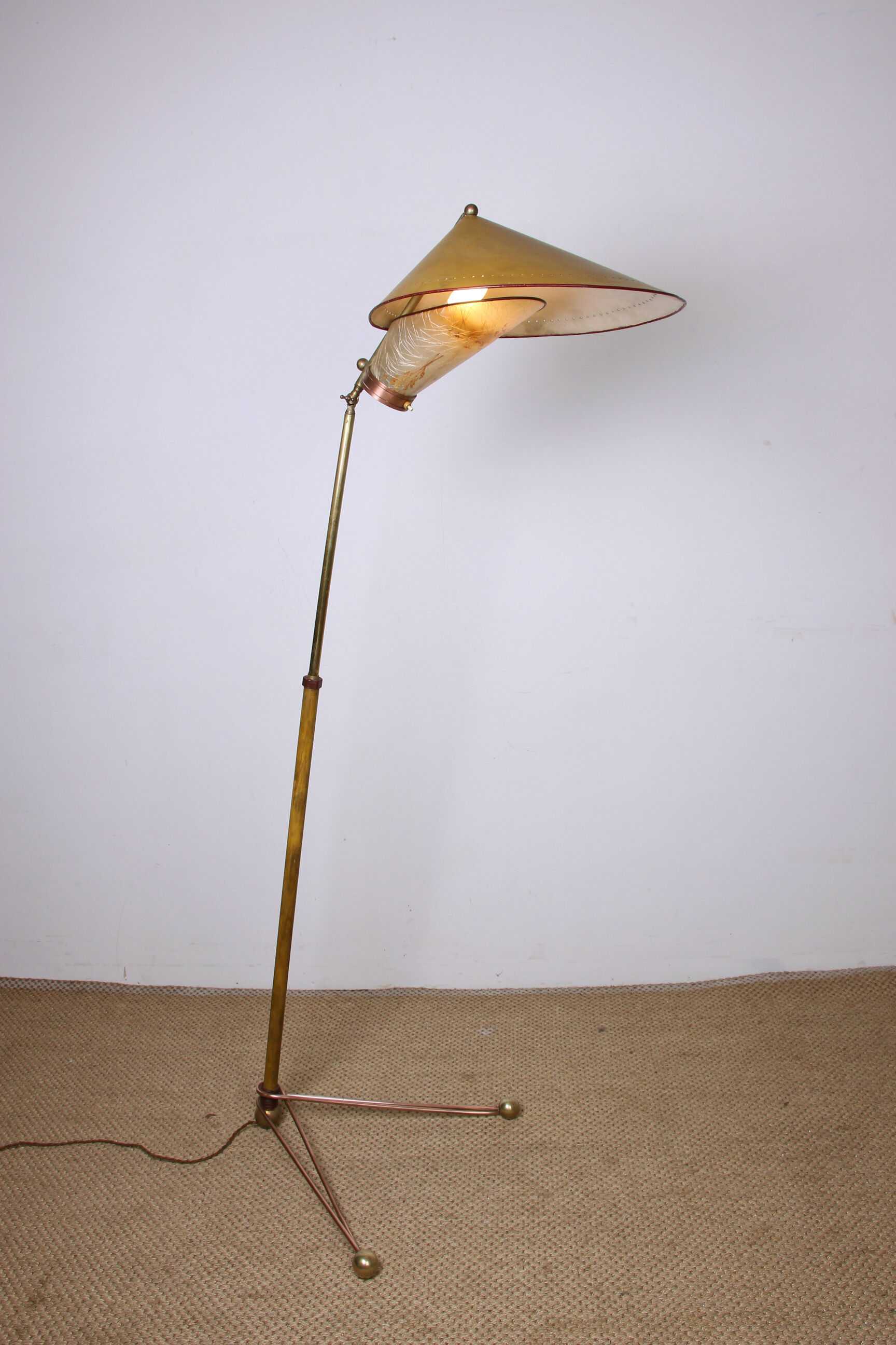 Italian brass floor lamp with conical shaft, adjustable in tilt and height, 1950