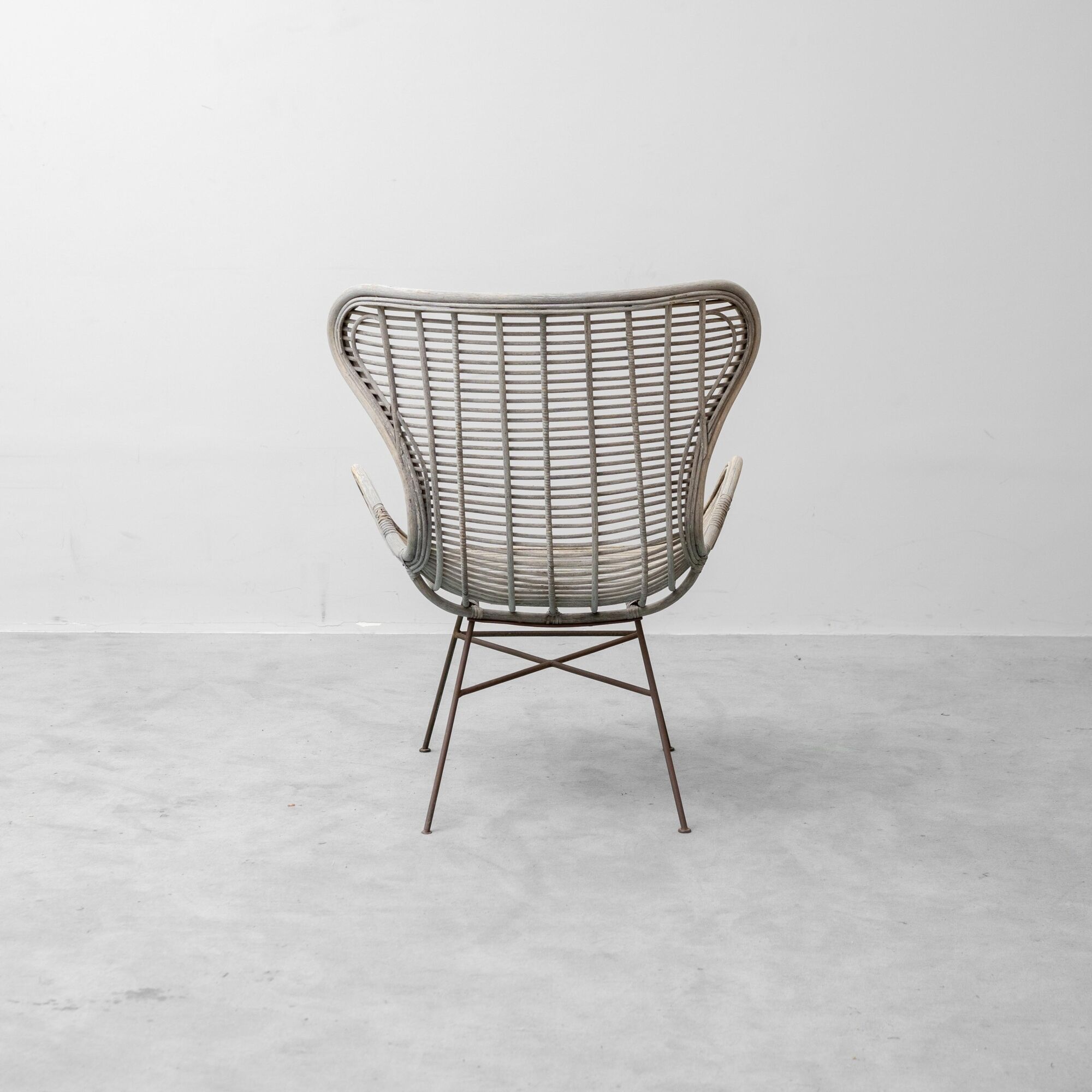 Vintage lounge armchair in rattan and metal, 1960s modernist design