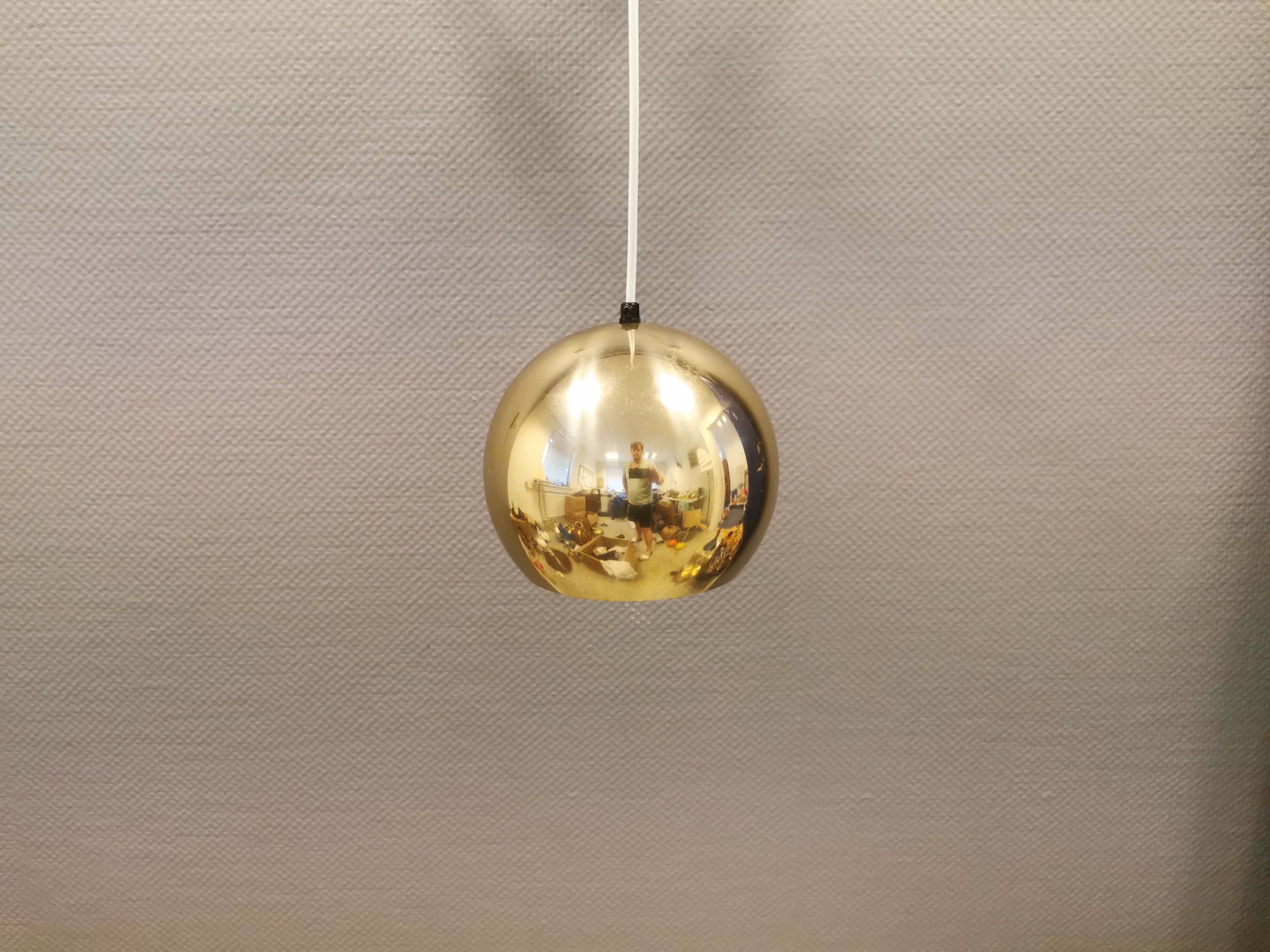 Danish ball lamp from the 80s, in gold colored lacquer.