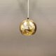 Danish ball lamp from the 80s, in gold colored lacquer.