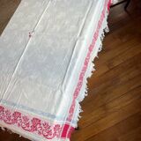 Old cotton tablecloth with flowers and fringes