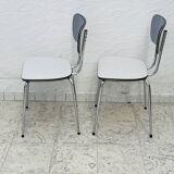 Set of two vintage grey Formica and chrome chairs.