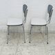 Set of two vintage grey Formica and chrome chairs.