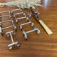 Set of 11 silver-plated metal knife holders, 1960