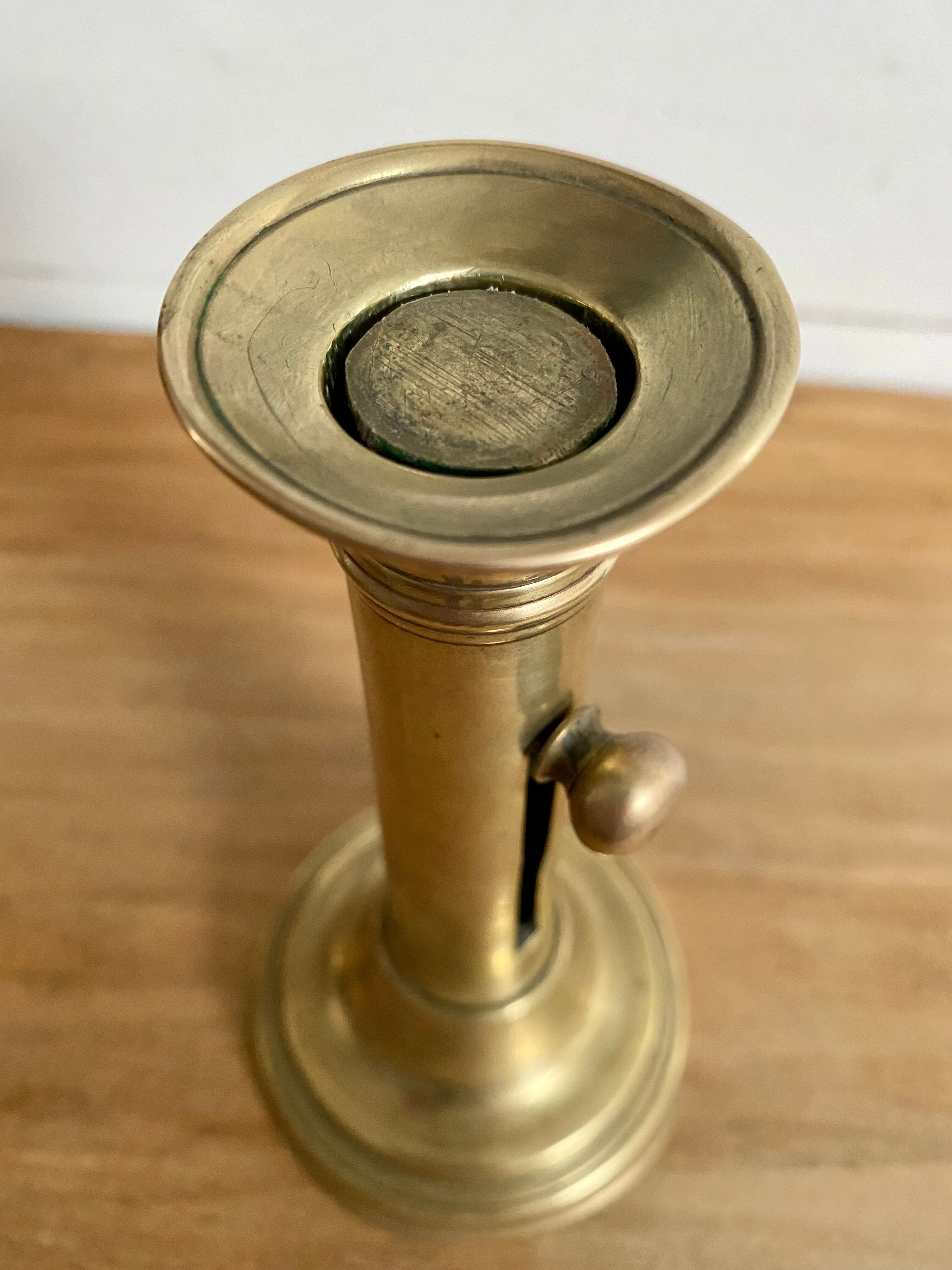 Nineteenth-century brass pull-out candle holder