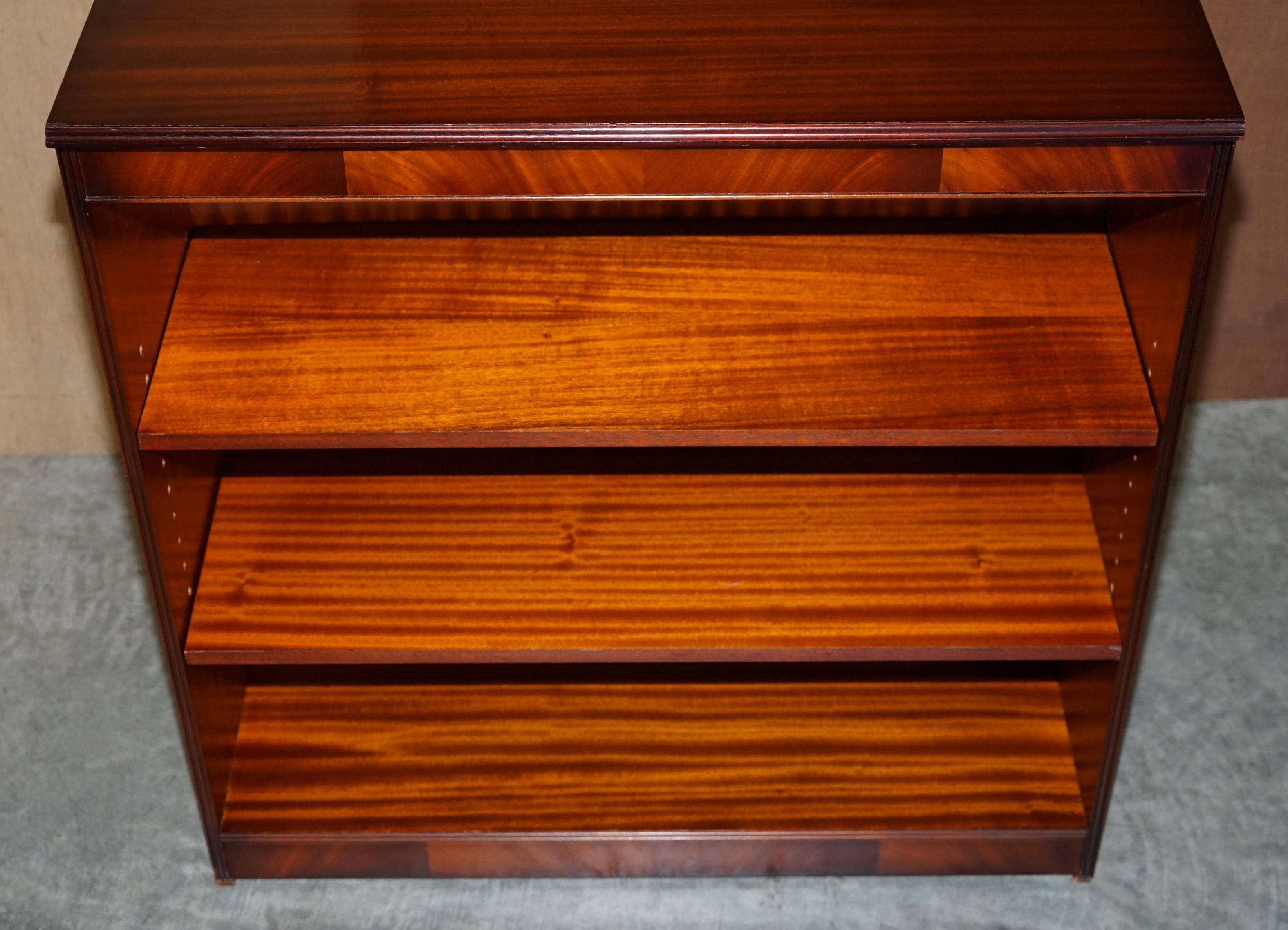 Pair of open low bookshelves Shaws of London in hardwood.
