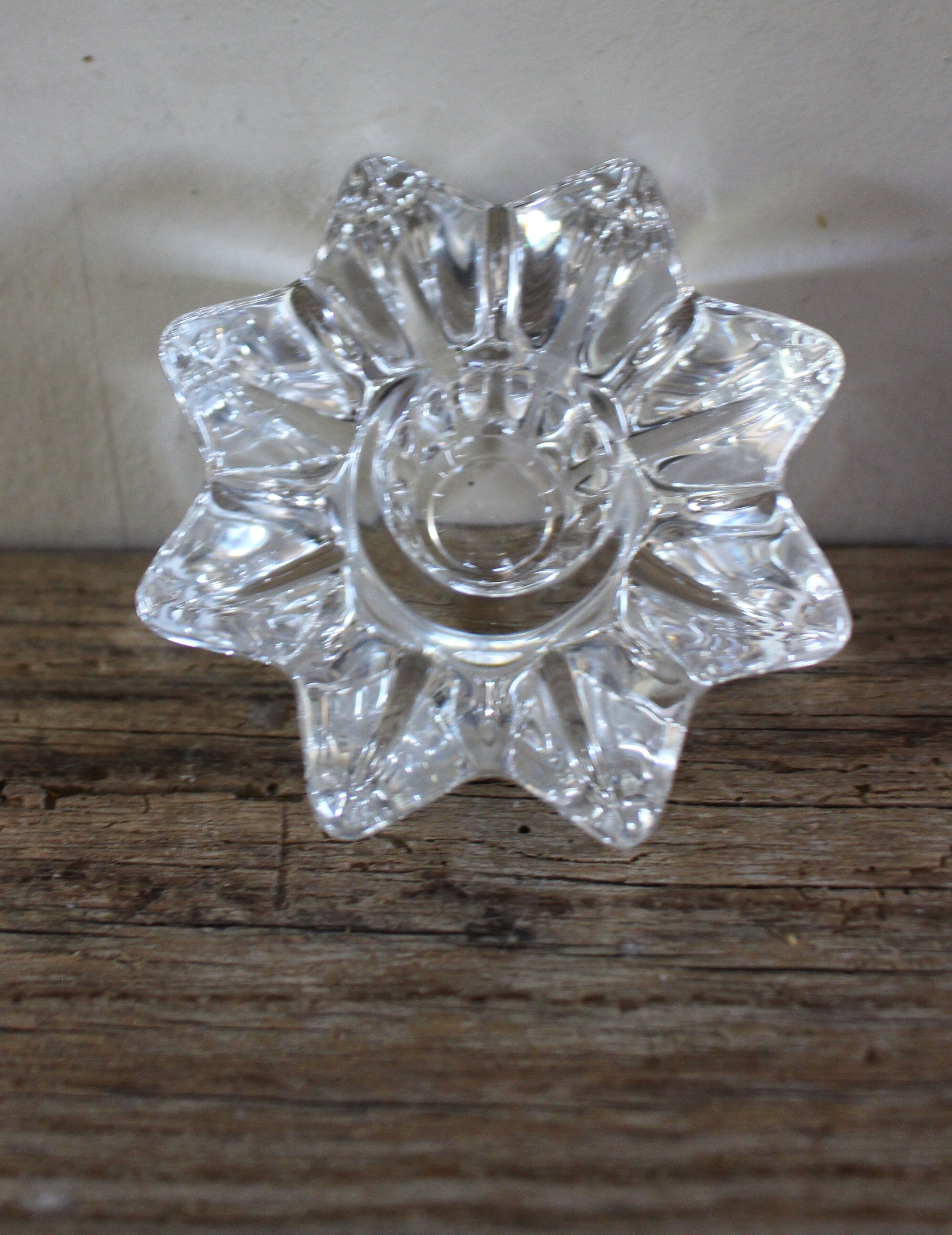 A vintage star flower glass candlestick.