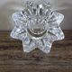 A vintage star flower glass candlestick.