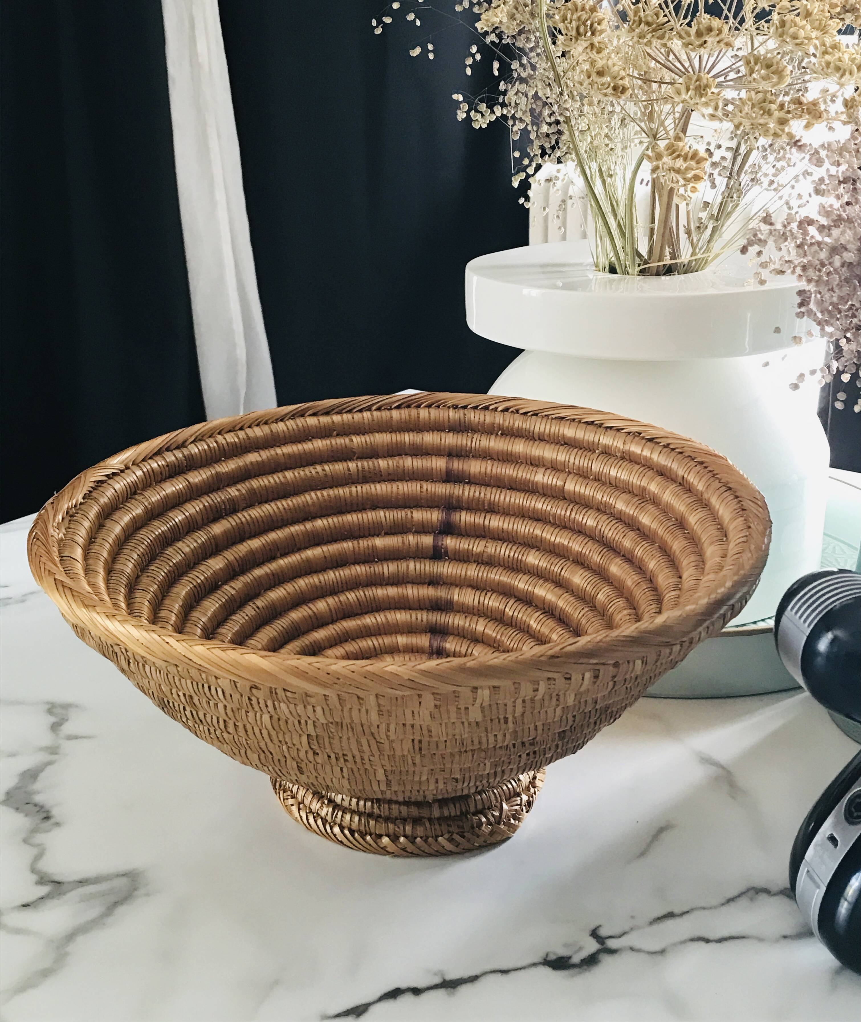 Large bowl on a woven wicker stand