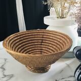 Large bowl on a woven wicker stand
