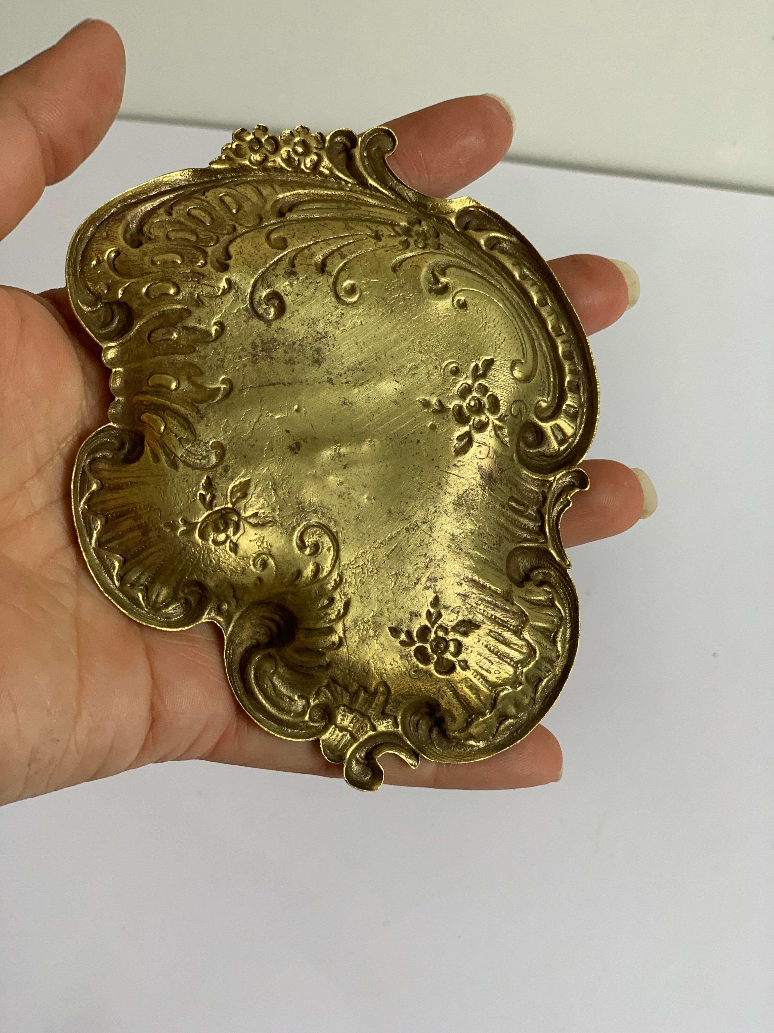 Empty art nouveau brass pocket