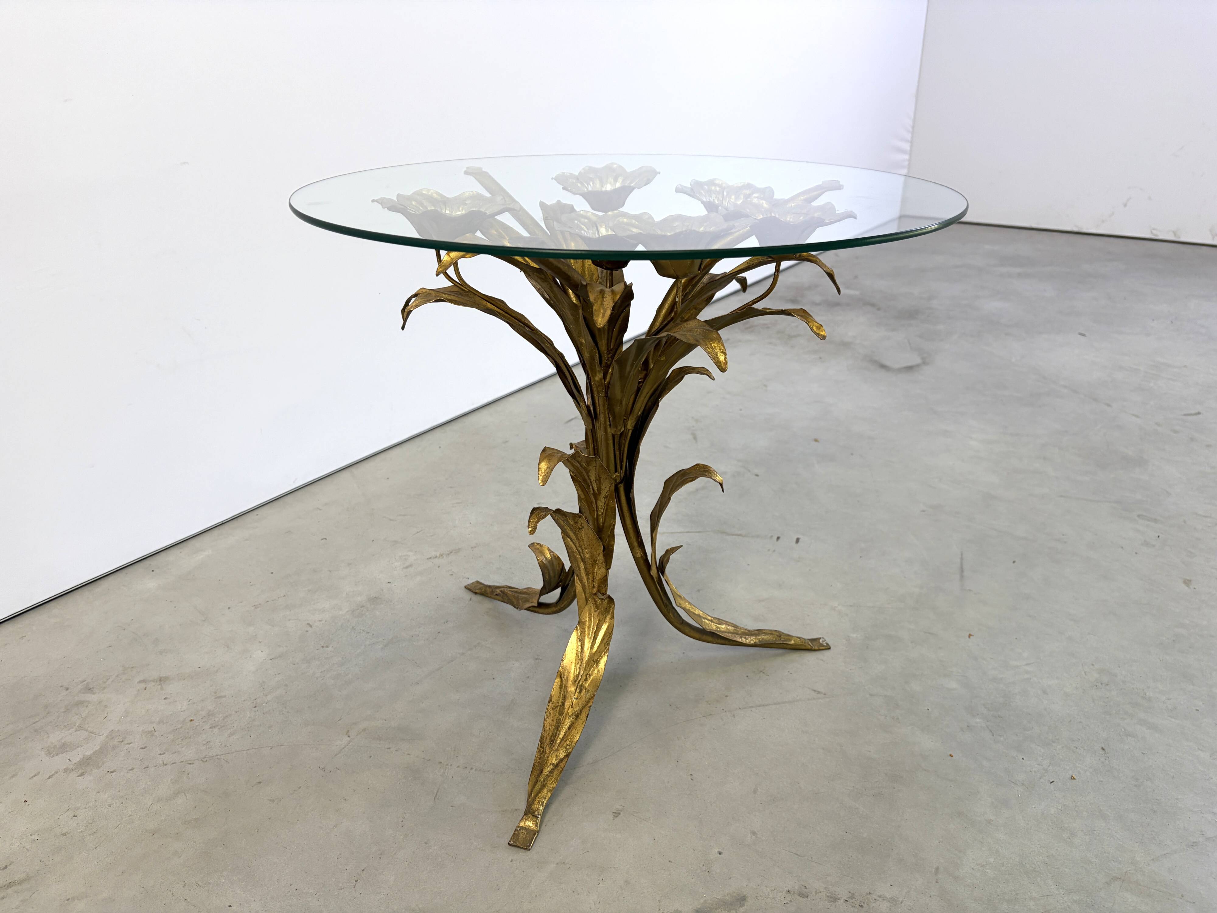 Charming metal flower coffee table or side table with a clear glass top. Made in Italy, attributed to Hans Kögl.