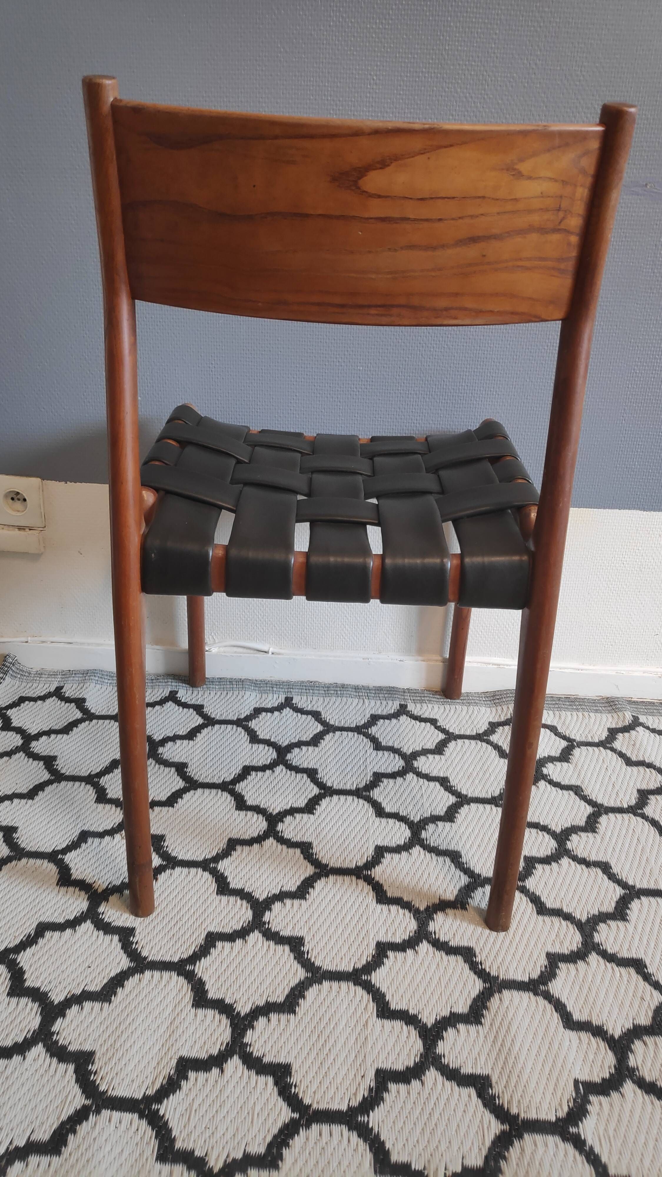 chair wooden structure and sitting with braiding of black skai strips