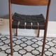 chair wooden structure and sitting with braiding of black skai strips