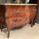 Curved commode with marquetry and marble top.