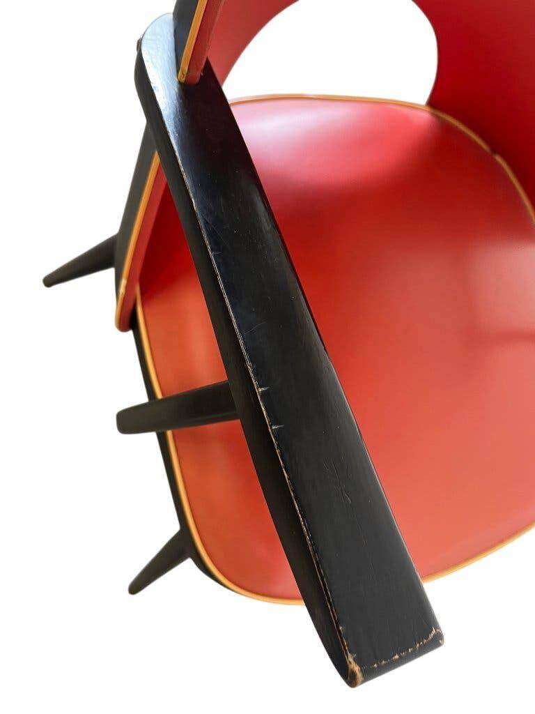 Vintage red rockabilly chair with armrest