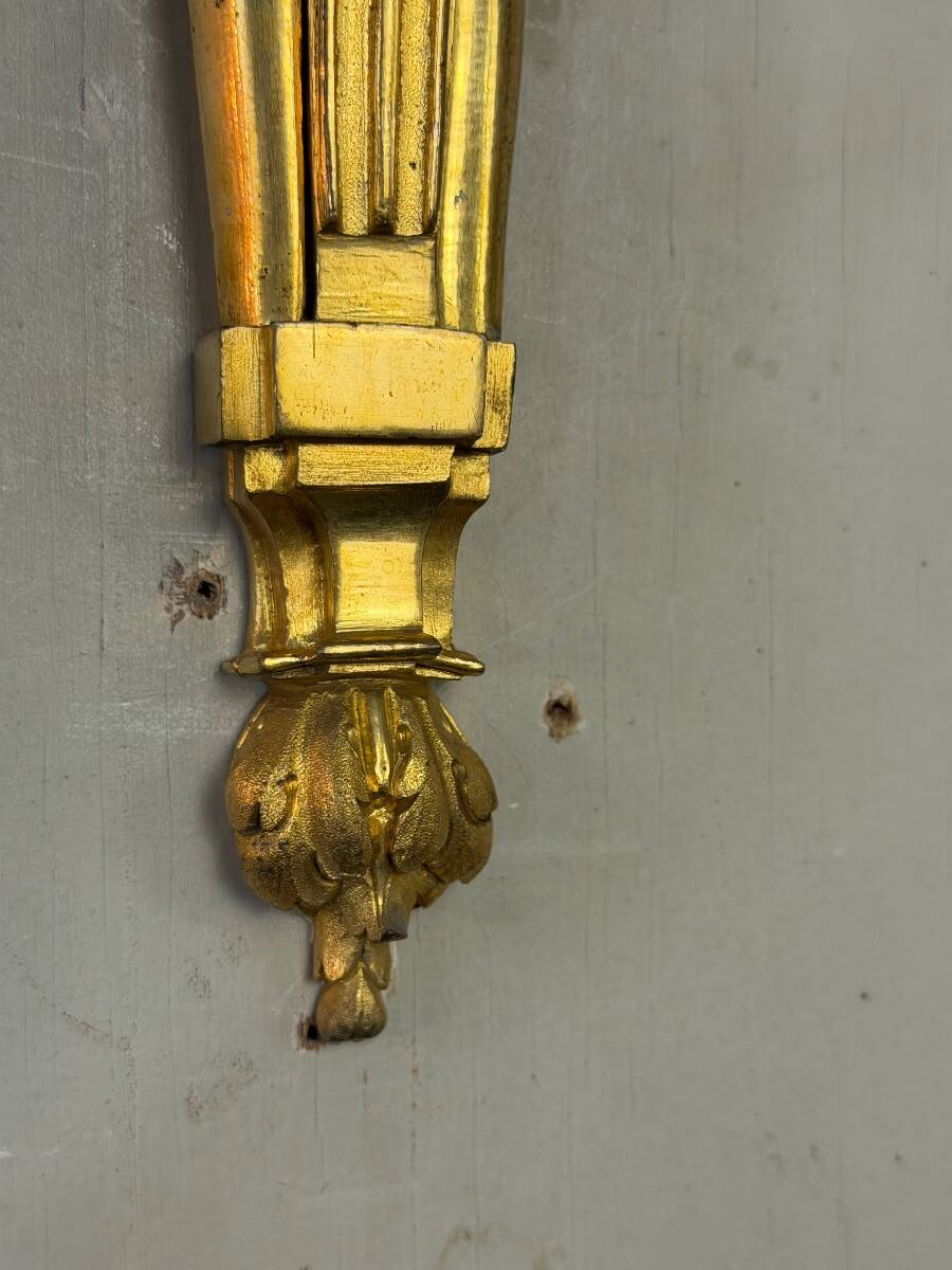 Pair of Louis XVI style wall sconces in gilded bronze, circa 1880.