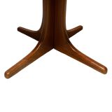 Baumann style wooden table with extensions.