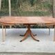 Extendable round dining table with central leg renovated in raw wood 205cm