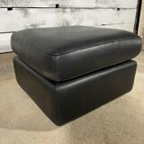 Black leather pouf