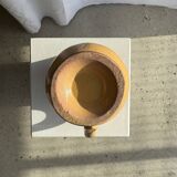 Large antique handmade ochre yellow jug with a pink flower pattern.